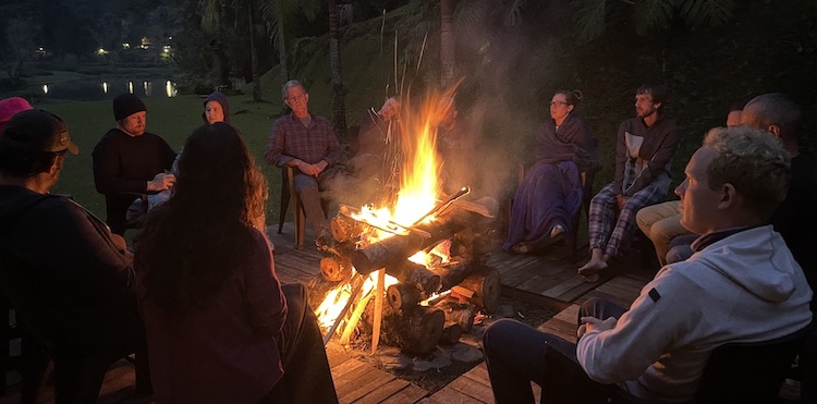 Sitting around the campfire at Ayahuasca House Retreat in Medellín, Antioquia, Colombia