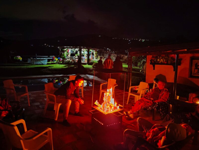 Sitting around the campfire at Ayahuasca in Colombia retreat in Fredonia Colombia.