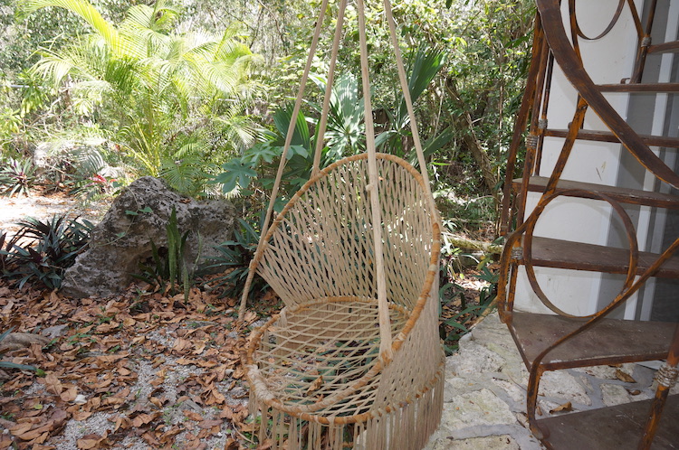 Hanging chair in the common area at Bliss Eden Ayahuasca Retreat in Tulum, Quintana Roo, Mexico