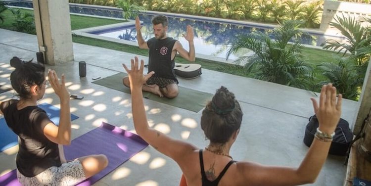 Marco Weimer leading a yoga class at Ancestral Retreats Ayahuasca Retreat Juan de Acosta Colombia