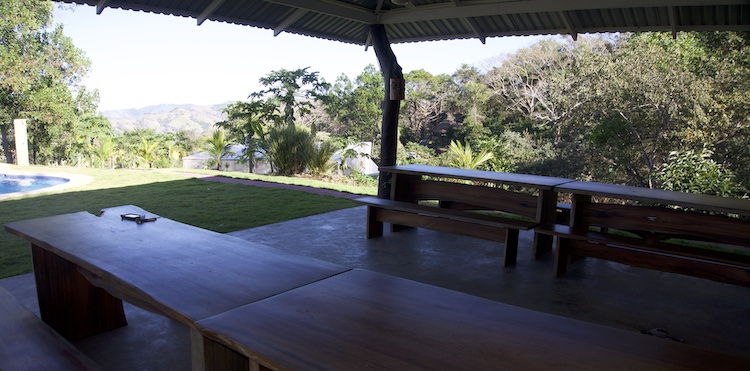 Outdoor common space at Om Jungle Medicine Ayahuasca Retreat in Samara, Guanacaste, Costa Rica