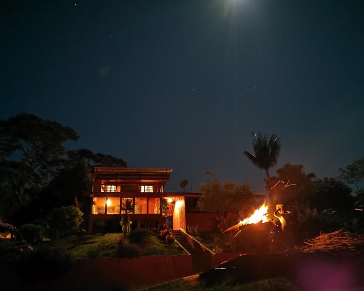 Night time view of the main building at Ayahuasca Costa Rica at San Isidro De el General