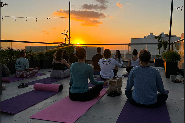 Yoga at the rooftop with sunset at Life Synergy Psilocybin Retreat Playa del Carmen Mexico