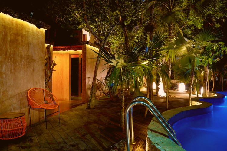 Dipping into dreams under the moonlit sky. Our pool at night is a shimmering oasis of relaxation and enchantment at Bufo Alvarius Sanctuary Bufo Alvarius Retreat in Tulum, Mexico