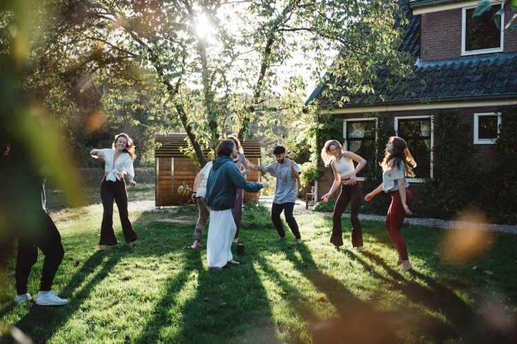 Rhythms of joy intertwine as our retreat becomes a dance floor of happiness. A united group swaying to the melodies of togetherness at New Eleusis Psilocybin Retreat Zeeveld The Netherlands