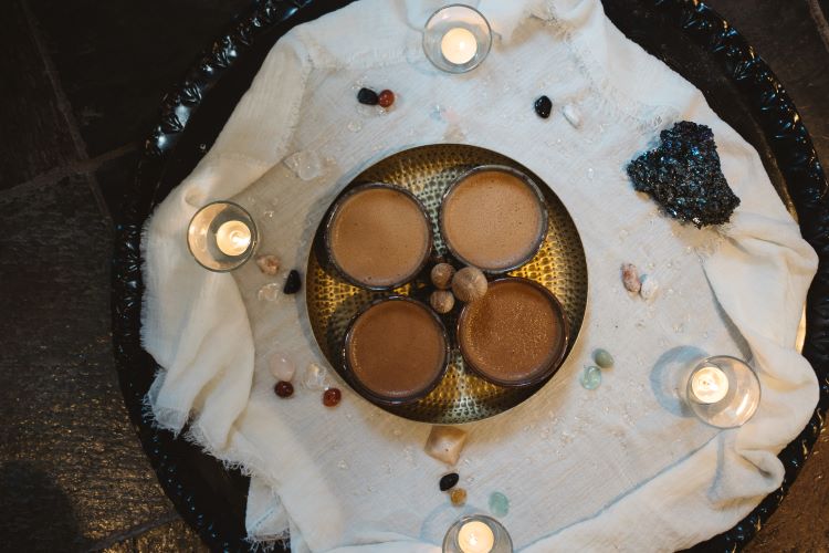 Within the retreat's sacred space, a ritual unfolds, weaving ancient traditions with modern intention at New Eleusis Psilocybin Retreat Zeeveld The Netherlands