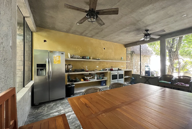 A shared kitchen, a place to create, connect, and savor the flavors of togetherness at One Breath of Yoga Psychedelic Retreat Puerto Morelos Mexico