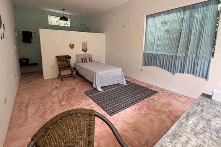 The single bed in a private room with private comfort room at One Breath of Yoga Psychedelic Retreat Puerto Morelos Mexico