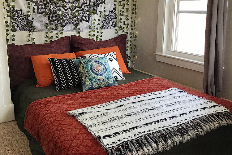 The comfortable bed with tribal design at Sacred Earth Sanctuary Psilocybin Retreat Amesbury Massachusetts