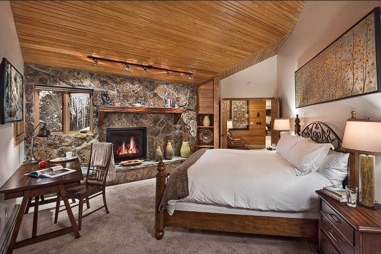 Indulge in ultimate relaxation in our luxury retreat bedroom. Every detail exudes elegance, from the sumptuous bedding to the tranquil ambiance. Unwind in style and embrace a restful escape like no other here at Women's Psychedelic Wellness Retreat in Steamboat Springs, Colorado