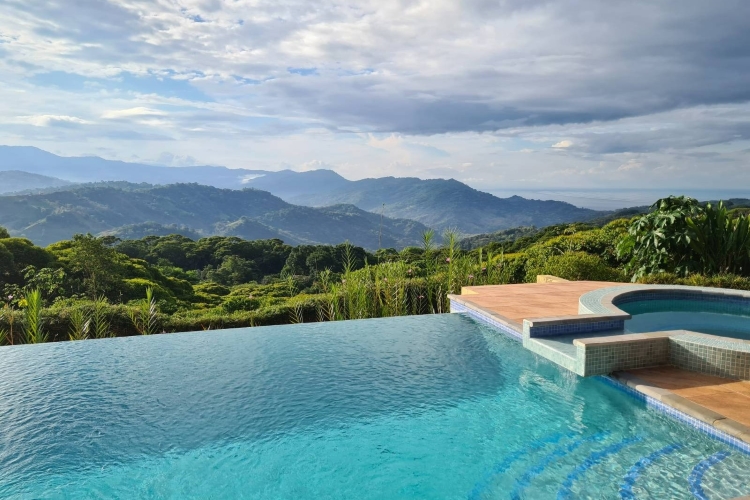 An infinity pool with a view at Mushroom Tao psilocybin retreat in Dominical, Costa Rica
