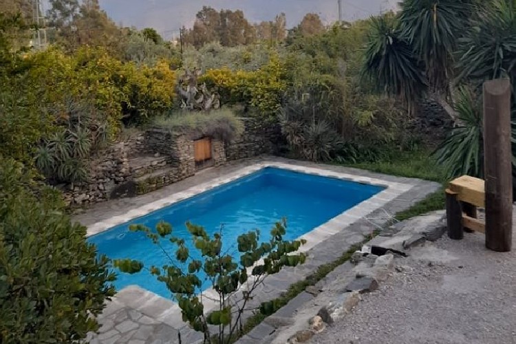 Dive into serenity at our retreat center's crystal-clear pool, where relaxation and rejuvenation meet in perfect harmony here at Madera Sagrada Ibogaine Retreat near Granada, Spain