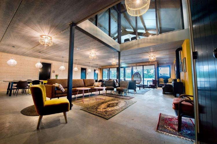 Step into the lap of modern elegance in our retreat center's exquisite living room. A sanctuary where style meets serenity, inviting you to unwind and savor the moment here at A Whole New High Psilocybin Retreat in Amsterdam, Netherlands