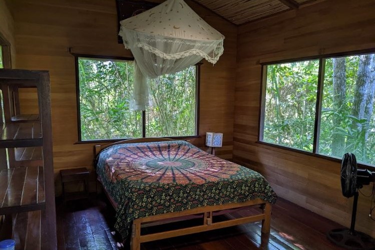 Rustic Serenity: Our Wooden Retreat Bedroom, Where Comfort Meets Nature's Charm at Nimea Kaya Healing Center Ayahuasca Retreat in Pucallpa Ucayali, Peru