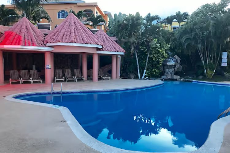Dive into a world of luxury and leisure at our poolside oasis within the heart of the building. Sparkling waters beckon, surrounded by architectural elegance here at Mycelia Psilocybin Retreat in Ocho Rios, Jamaica.