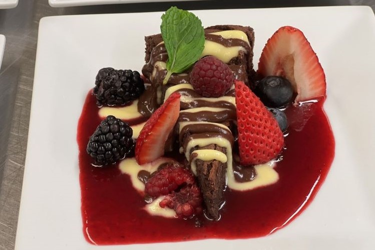 Decadence in the Desert: A Perfect Harmony of Rich Chocolate Cake and Fresh Strawberries, Prepared with Love
